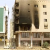 Một tòa nhà bị hư hại do giao tranh giữa quân đội Sudan và lực lượng bán quân sự RSF tại Khartoum, Sudan ngày 23/4/2023. (Ảnh: AFP/TTXVN)