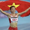 Vận động viên Nguyễn Thị Oanh giành huy chương Vàng môn điền kinh nội dung 5000m nữ. (Ảnh: Minh Quyết/TTXVN)