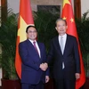 Thủ tướng Phạm Minh Chính hội kiến Ủy viên trưởng Nhân đại Toàn quốc Trung Quốc Triệu Lạc Tế. (Ảnh: Dương Giang/TTXVN)