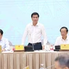Thứ trưởng Bộ Xây dựng Nguyễn Tường Văn trả lời câu hỏi của các cơ quan báo chí. (Ảnh: An Đăng/TTXVN)