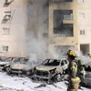 Xe ôtô bị cháy sau cuộc tấn công bằng rocket từ Dải Gaza tại Ashkelon, Israel, ngày 7/10/2023 . (Ảnh: AFP/TTXVN)