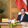 Thủ tướng Phạm Minh Chính hội đàm trực tuyến với Thủ tướng Đan Mạch Mette Frederiksen. (Ảnh: Dương Giang/TTXVN)