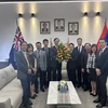 Đoàn Đại biểu Sứ quán Việt Nam tại Australia do Đại sứ Nguyễn Tất Thành dẫn đầu đến chúc mừng Quốc khánh Cộng hòa Dân chủ Nhân dân Lào. (Ảnh: TTXVN phát)