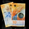 Đồng tiền mệnh giá 10 franc Thụy Sĩ tại Lausanne. (Ảnh: AFP/TTXVN)