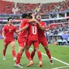 Các tuyển thủ Việt Nam ăn mừng bàn thắng vào lưới Đội tuyển Nhật Bản. (Ảnh: THX/TTXVN)