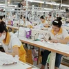 Hoạt động sản xuất tại một nhà máy may thêu xuất khẩu tại Lào Cai. (Ảnh: Quốc Khánh/TTXVN)