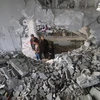 Tòa nhà bị phá hủy sau cuộc không kích của Israel xuống Rafah, Dải Gaza, ngày 22/3/2024. (Ảnh: THX/TTXVN)