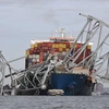 Hiện trường vụ sập cầu Francis Scott Key ở thành phố Baltimore, bang Maryland (Mỹ), sau khi bị tàu chở hàng đâm trúng, ngày 26/3/2024. (Ảnh: AFP/TTXVN)
