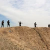 Các lực lượng Iraq tham gia chiến dịch truy quét IS tại al-Miqdadiyah, tỉnh Diyala, Iraq, ngày 10/3/2024. (Ảnh: AFP/TTXVN)