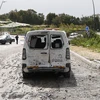 Ôtô bị phá hủy do trúng rocket tại Kiryat Shmona ở miền bắc Israel, gần biên giới với Liban ngày 27/3/2024. (Ảnh: AFP/TTXVN)