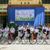 10 chiếc xe đạp được trao cho học sinh có hoàn cảnh khó khăn trên địa bàn xã Tân Bình, huyện Tân Biên, tỉnh Tây Ninh. (Ảnh: Giang Phương/TTXVN)