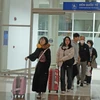 Hành khách tại Cảng hàng không Liên Khương. (Ảnh: Nguyễn Dũng/TTXVN)