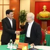 Tổng Bí thư Nguyễn Phú Trọng và Tổng Bí thư, Chủ tịch nước Lào Thongloun Sisoulith. (Ảnh: Trí Dũng/TTXVN)