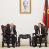 Phó Thủ tướng Trần Lưu Quang tiếp Bộ trưởng Cựu chiến binh và Người có công Algeria Laid Rebigua. (Ảnh: Lâm Khánh/TTXVN)