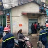 Vụ cháy bất ngờ tại khu chung cư Giảng Võ khiến nhiều người dân hoảng hốt. (Ảnh: PV/Vietnam+)