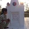 Chị Lê Thị Lụm vẫn khắc khoải chờ 2 chữ 'công lý' sẽ đến với gia đình mình. (Ảnh: PV/Vietnam+)
