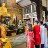 Một lễ cưới nơi cửa Phật với niềm tin được Đức Phật chứng giám, ban phúc lành về sau là lý do 14 đôi bạn trẻ ở Hà Nội đã cùng tham dự lễ 'Hằng thuận'. (Ảnh: Minh Sơn/Vietnam+) 