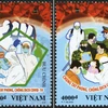 Hai mẫu của bộ tem 'Chung tay phòng, chống dịch Covid-19'. (Ảnh: Bưu điện Việt Nam)