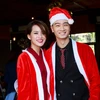 Slim V và bạn gái Huyền Trang tại buổi họp báo trình làng album hòa tấu chủ đề Giáng sinh. (Ảnh: Hồ Điệp)