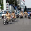 Lực lượng Cảnh sát giao thông và Thanh tra giao thông ra quân tuần tra trên các tuyến đường. (Ảnh. Hoàng Hải/TTXVN)