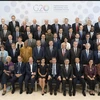 Các Bộ trưởng Tài chính và Thống đốc Ngân hàng nhóm các nền kinh tế phát triển và mới nổi (G20) chụp ảnh chung tại Hội nghị thường niên Quỹ Tiền tệ quốc tế (IMF)-Ngân hàng Thế giới (WB) tại Bali, Indonesia, ngày 12/10/2018. (Nguồn: AFP/ TTXVN)