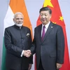 Thủ tướng Ấn Độ Narendra Modi (trái) và Chủ tịch Trung Quốc Tập Cận Bình (phải) tại cuộc gặp bên lề Hội nghị G20 ở Buenos Aires, Argentina, ngày 30/11/2018. (Nguồn: THX/TTXVN)