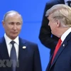 Tổng thống Nga Vladimir Putin (trái) và Tổng thống Mỹ Donald Trump tại Hội nghị thượng đỉnh Nhóm các nền kinh tế phát triển và mới nổi hàng đầu thế giới (G20) diễn ra ở thủ đô Buenos Aires, Argentina ngày 30/11/2018. (Ảnh: AFP/ TTXVN)