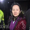 Giám đốc Tài chính của Tập đoàn Huawei, bà Mạnh Vãn Chu, rời khỏi tòa án tối cao ở Vancouver, Canada ngày 11/12/2018. (Nguồn: AFP/TTXVN)