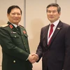Bộ trưởng Quốc phòng Việt Nam Ngô Xuân Lịch và Bộ trưởng Bộ Quốc phòng Hàn Quốc Jeong Kyeong-doo. (Ảnh: Xuân Vịnh/TTXVN)