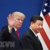 Tổng thống Mỹ Donald Trump (trái) và Chủ tịch Trung Quốc Tập Cận Bình trong cuộc gặp tại Bắc Kinh (Trung Quốc). (Nguồn: AFP/TTXVN)