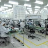 Sản xuất linh kiện điện tử tại Công ty trách nhiệm hữu hạn Doosung Tech Viet Nam (100% vốn đầu tư của Hàn Quốc), ở Khu công nghiệp Lương Sơn (Hòa Bình). (Ảnh: Danh Lam/TTXVN)