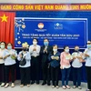 Nova Group trao tặng quà Tết Tân Sửu 2021 cho các hộ nghèo, hộ khó khăn, nạn nhân chất độc da cam thành phố Biên Hòa. (Ảnh: Minh Sơn/Vietnam+)