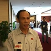 Đại biểu Trương Văn Vở trả lời báo chí bên lề Quốc hội. (Ảnh: PV/Vietnam+)