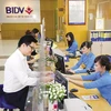 Khách hàng giao dịch tại BIDV. (Nguồn: BIDV)