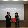 Phó Thống đốc NHNN Nguyễn Kim Anh trao quyết định đại diện phần vốn Nhà nước tại NAPAS cho bà Nguyễn Tú Anh. (Nguồn: NAPAS)
