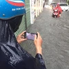 Mưa ngập tại đường Vũ Trọng Phụng đã khiến cho nhiều xe chết máy. (Nguồn: Sơn Bách/Vietnam+)