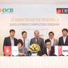 Lễ ký kết nghiệm thu hoàn thành dự án Basel II giữa lãnh đạo OCB và Ngân hàng Phát triển Singapore. (Nguồn: OCB)