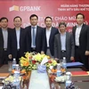 Phó Thống đốc NHNN Đào Minh Tú (thứ 4 từ trái sang) làm việc với GPBank. (Nguồn: NHNN)