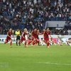 Niềm vui chiến thắng của các tuyển thủ Việt Nam sau khi Bùi Tiến Dũng thực hiện thành công quả penalty quyết định (Nguồn: AFP/TTXVN)