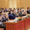 Thống đốc Ngân hàng Nhà nước Lê Minh Hưng cùng các đại biểu tam dự hội nghị. (Ảnh: CTV/Vietnam+)