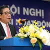 Ông Nguyễn Kim Anh, Phó Thống đốc NHNN chỉ đạo tại hội nghị. (Ảnh: CTV/Vietnam+)