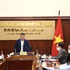 Thống đốc Ngân hàng Nhà nước Lê Minh Hưng chỉ đạo tại Hội nghị trực tuyến. (Ảnh: CTV/Vietnam+)