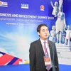 Chủ tịch Hội đồng quản trị Vietcombank trả lời phỏng vấn bên lề Hội nghị. (Ảnh: Vietnam+)