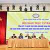 Phó Thường trực Trương Hòa Bình cùng ban lãnh đạo Ngân hàng Nhà nước chỉ đạo tại Hội nghị. (Ảnh: CTV/Vietnanm+)