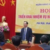 Phó Thống đốc Đào Minh Tú phát biểu tại họp báo. (Ảnh: PV/Vietnam+)