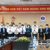 Đại điện các ngân hàng Vietcombank, HDBank, VietinBank, BIDV, Agribank và các tập đoàn đã đóng góp hàng trăm tỷ đồng cho chương trình vaccine phòng COVID-19. (Ảnh: CTV/Vietnam+)