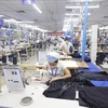 Nhiều doanh nghiệp ở Bắc Giang được vay vốn trả lương phục hồi sản xuất hoạt động trở lại. (Ảnh: TTXVN) 