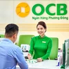 Giao dịch tại OCB. (Ảnh: Vietnam+)