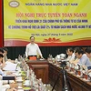 Phó Thống đốc Đào Minh Tú phát biểu chỉ đạo tại hội nghị. (Ảnh: Vietnam+)