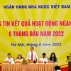 Phó Thống đốc NHNN Đào Minh Tú phát biểu tại buổi họp báo. (Ảnh: CTV/Vietnam+)